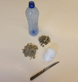 Petfles, zand, watten een proefje voor thuis Wonderwel